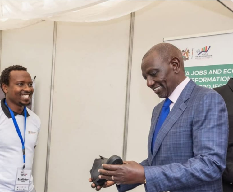 H.E the President Dr. William Ruto interacting with KJET beneficiaries, Leonard Ng’etich, founder of Lenel Leather and Peris Wangui from Limuru  dairy during the World MSME Day celebrations at KICC Nairobi. 