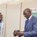 H.E the President Dr. William Ruto interacting with KJET beneficiaries, Leonard Ng’etich, founder of Lenel Leather and Peris Wangui from Limuru  dairy during the World MSME Day celebrations at KICC Nairobi. 
